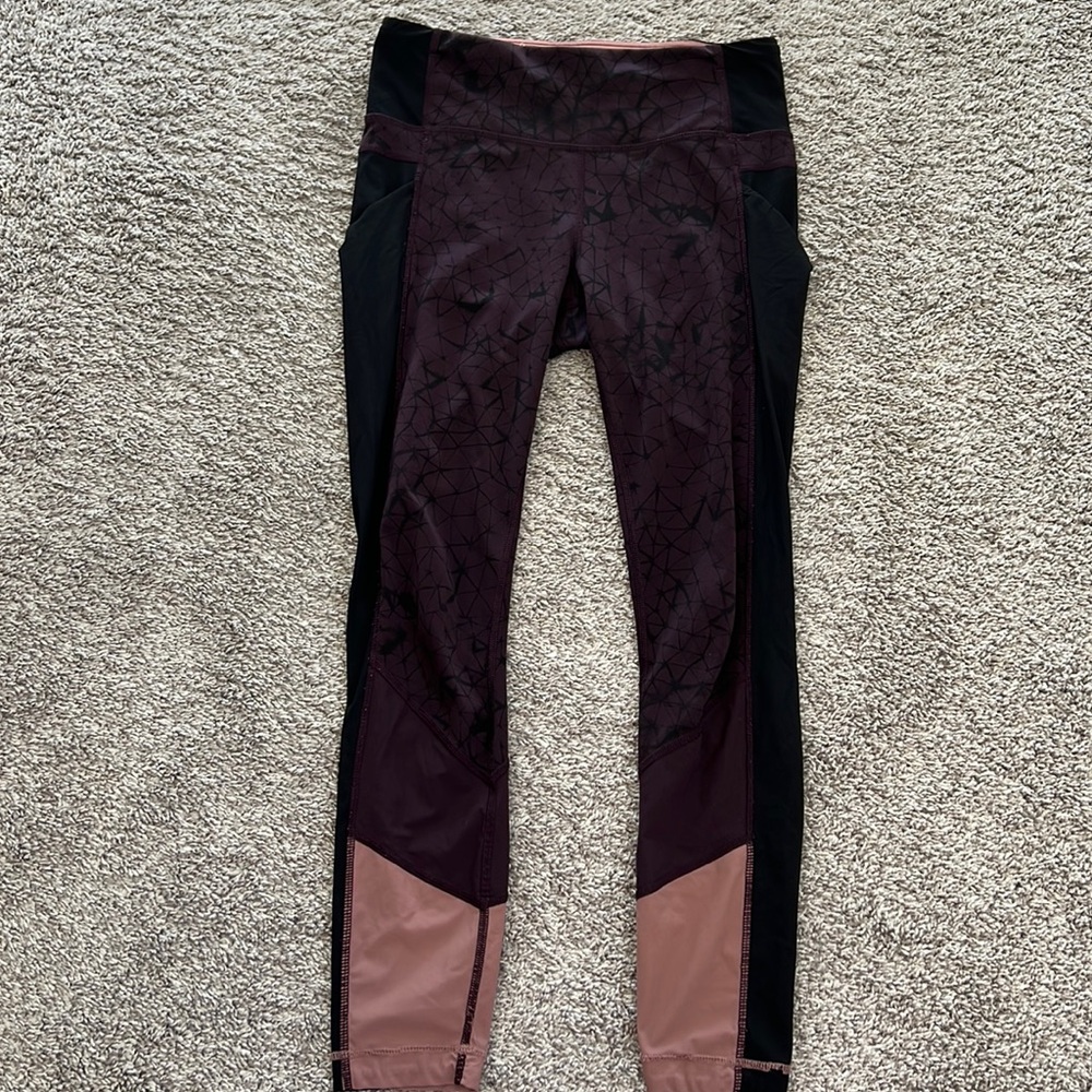 Maroon and black lululemon leggings.
